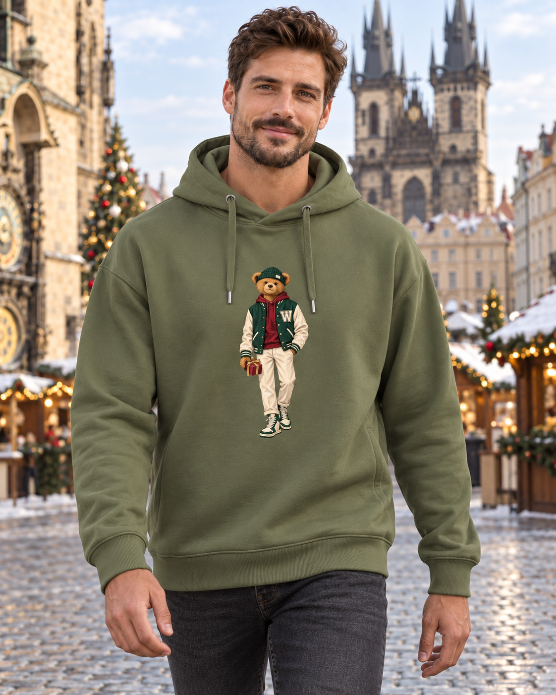 Man in a khaki Winter Club bear hoodie on Christmas-decorated Old Town Square in Prague.